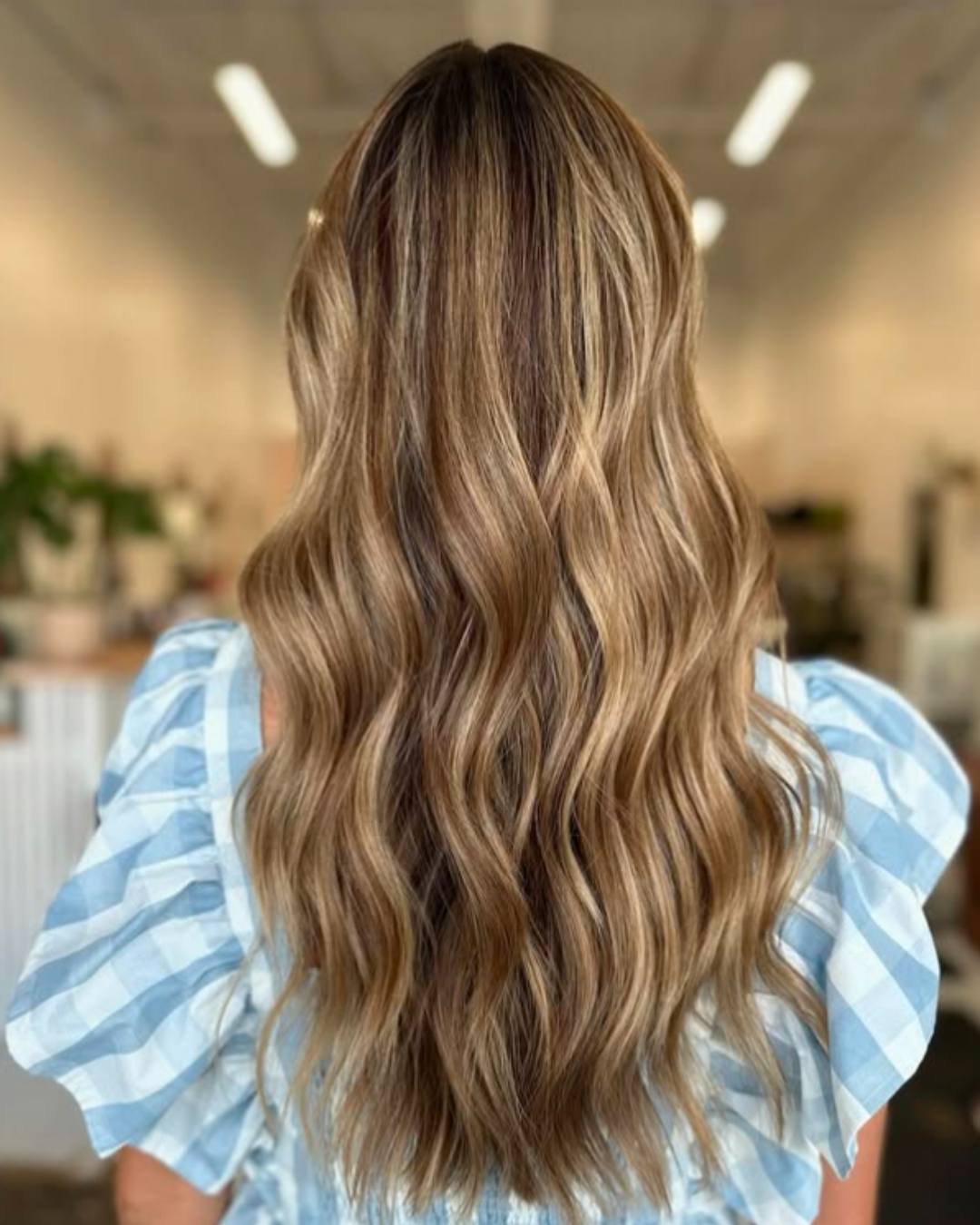 Long beachy blonde waves with dimensional highlights by Angela.