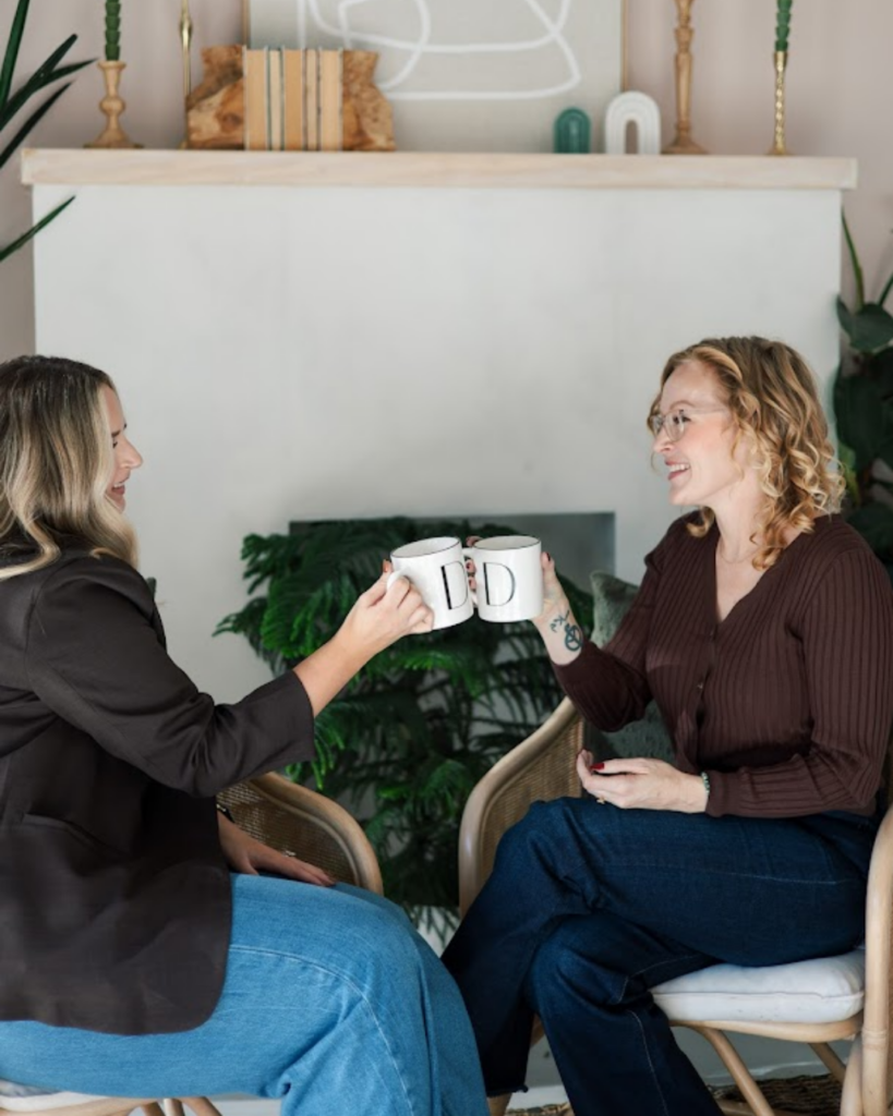 Salon owner Angela Wall sharing coffee with a client during the best salon experience in Fort Worth, TX.
