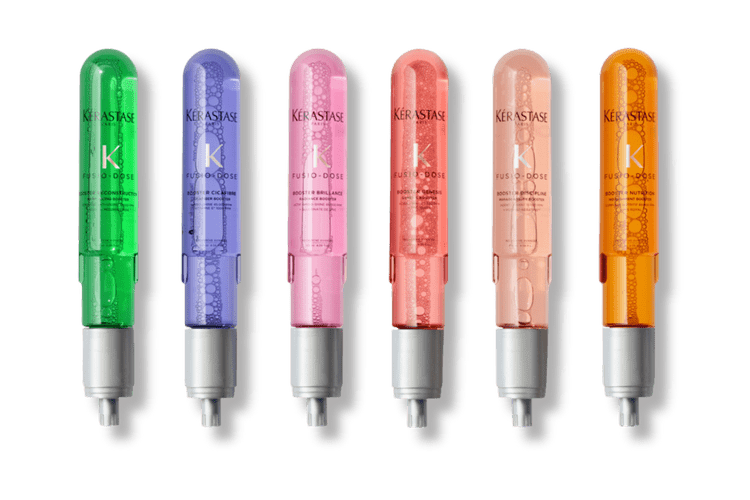 Lineup of colorful Kérastase Fusio-Dose hair treatment booster ampoules available in Dallas-Fort Worth, Texas.