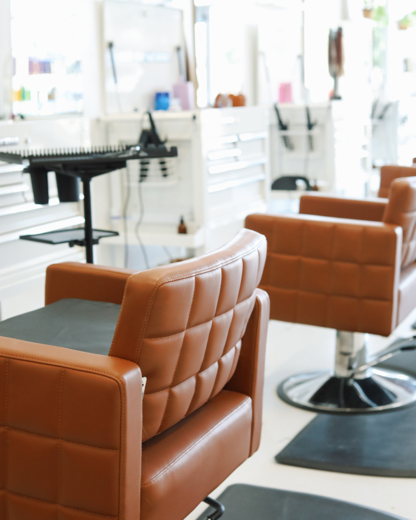 Interior view of styling chairs and equipment inside a Dwell Studio hair salon in Dallas-Fort Worth, Texas.